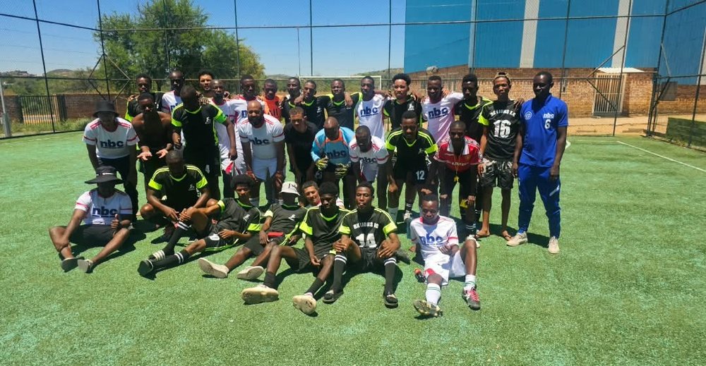 Players posing together after a match